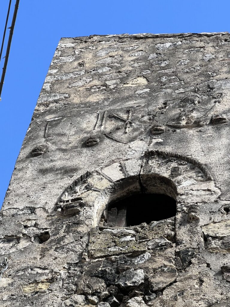 Casa Sferra. If you zoom in on the facade you can see noble coats of arms, which according to local tradition, refer to Pope Clement VII.